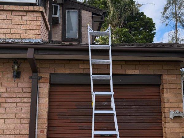 Ladder set up at a garage roofline for a roof void inspection in Sydney